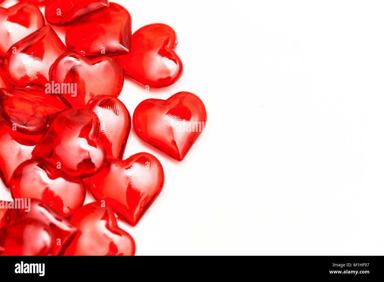 Red love hearts on a plain white background Stock Photo - Alamy