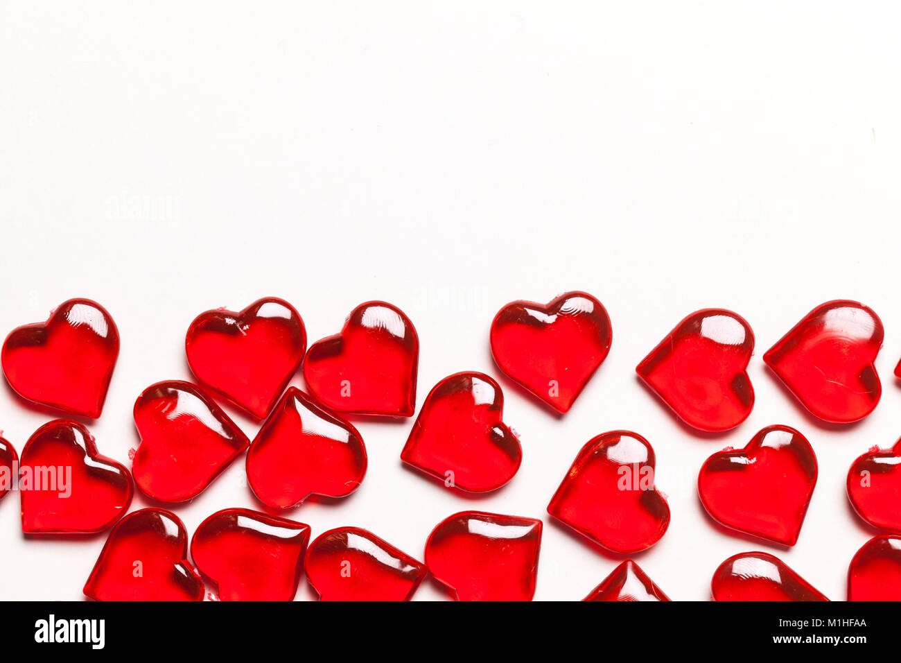 Red love hearts on a plain white background Stock Photo - Alamy