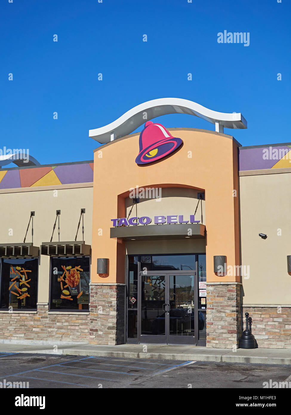 Exterior front entrance to fast food restaurant Taco Bell showing the corporate logo and current design in Montgomery, Alabama United States. Stock Photo