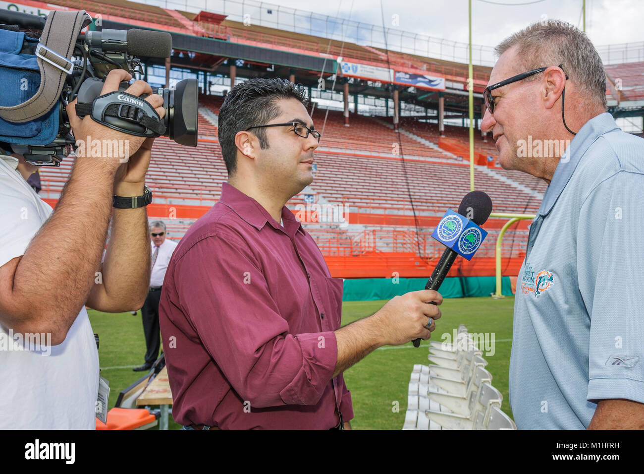 Retired american football player hires stock photography and images