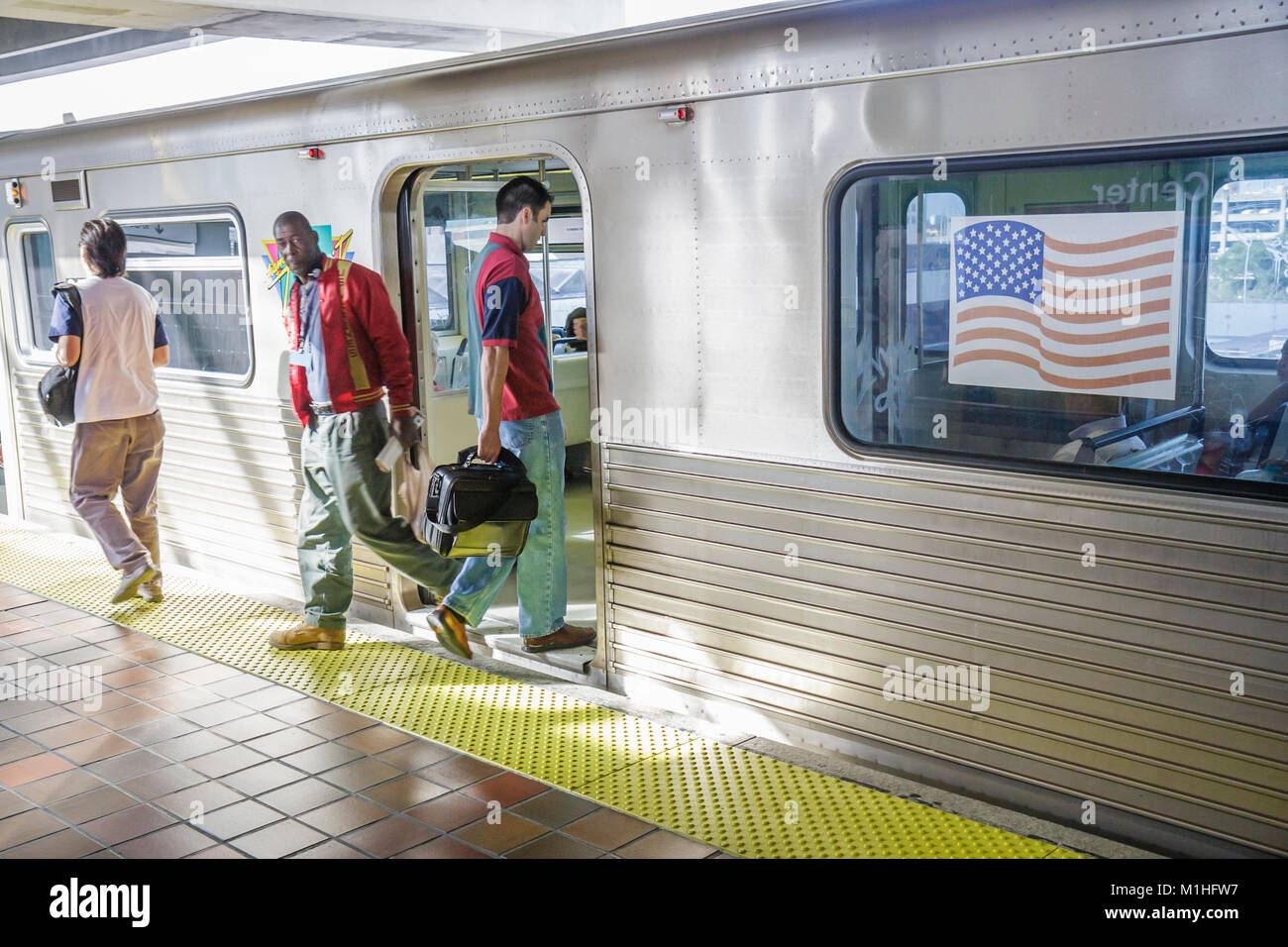 Miami Florida,Government Center Station,Metrorail,train,public transportation,passenger passengers rider riders,commuters,visitors travel traveling to Stock Photo