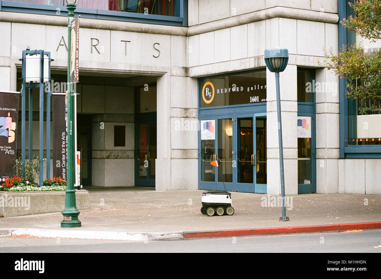 Self-driving delivery robot from startup Starship Technologies drives past the Lesher Center in downtown Walnut Creek, California, as it makes an automated delivery for a local business, August 24, 2017. () Stock Photo