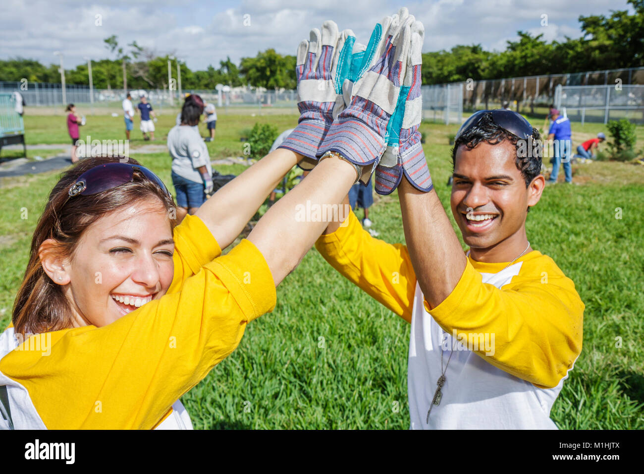 Miami Florida,Allapattah Middle School,campus,Hands On HandsOn Miami,volunteer volunteers volunteering work worker workers,teamwork working together s Stock Photo