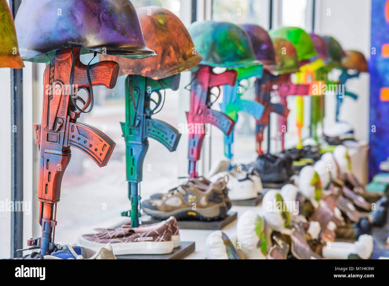 Miami Beach Florida,Washington Avenue,peace activist,Asian artist Huong,guns,helmet,anti war,gallery,galleries,dealer,dealers,gallerist,collection,FL0 Stock Photo