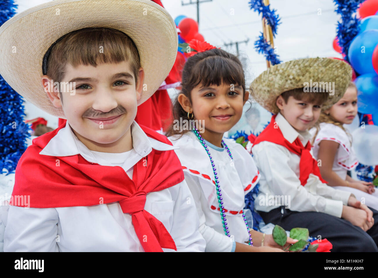 Florida,Hialeah,Jose Marti Parade,honoring Cuban poet,participant,Hispanic boy boys male girl,girls female kids children costume,straw hat,FL080120040 Stock Photo
