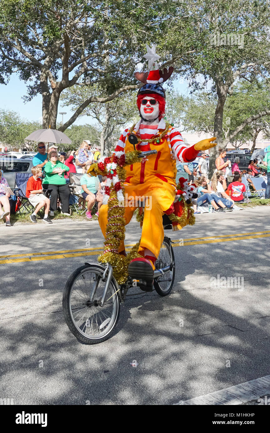 Ronald McDonald riding a bike during the Hobe Sound Christmas Parade, Hobe Sound, Martin County, Florida, USA Stock Photo