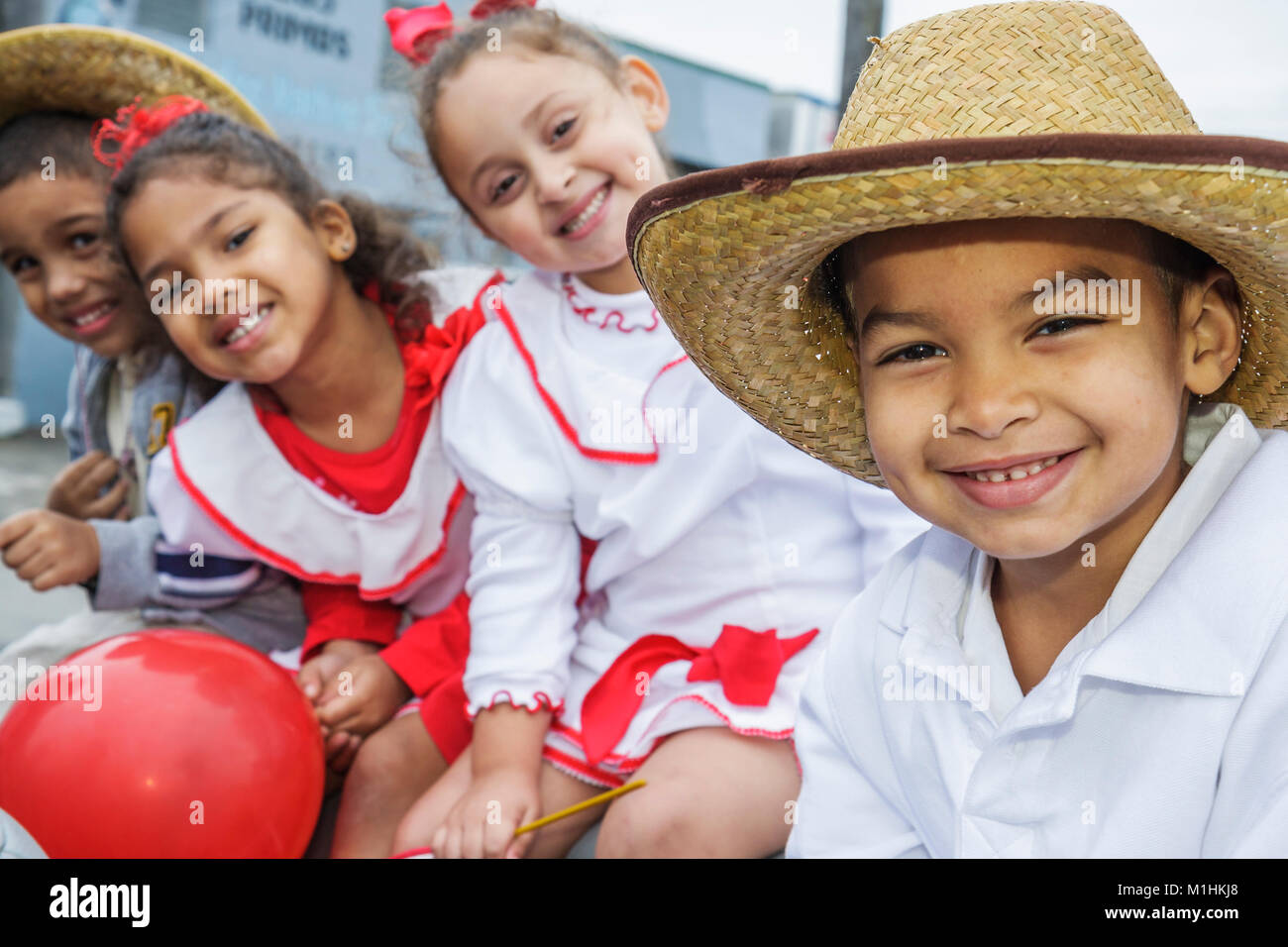 Florida,Hialeah,Jose Marti Parade,honoring Cuban poet,participant,Hispanic boy boys male kids children girls,costume,straw hat,FL080120048 Stock Photo