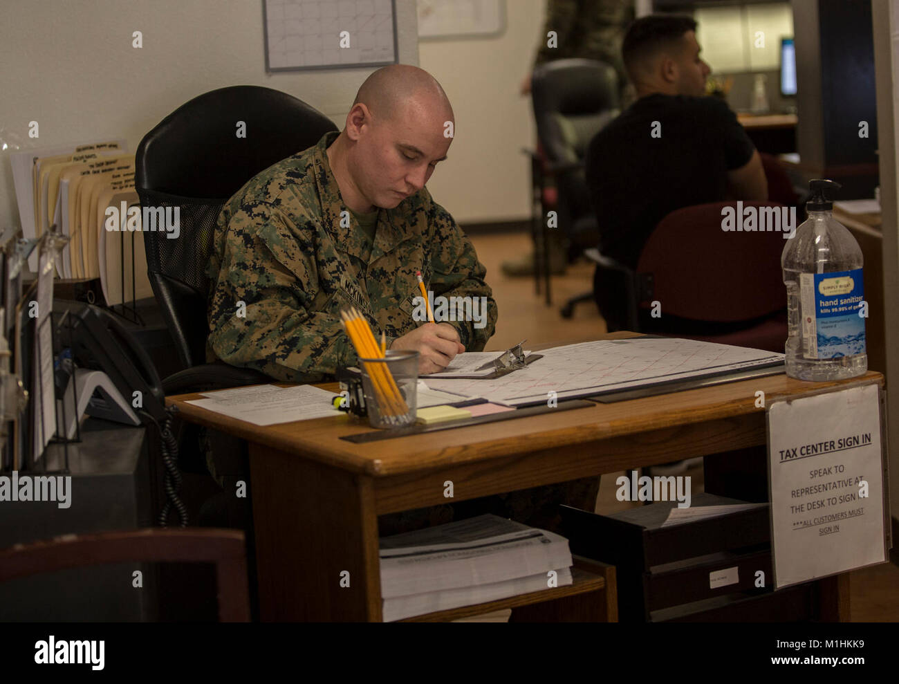 U.S. Marine Corps Lance Cpl. Daniel McKinstry, an airframe mechanic assigned to the Search and Rescue Unit with Headquarters & Headquarters Squadron, completes initial paperwork for clients that want to have their taxes prepared by the Volunteer Income Tax Assistance (VITA) Tax Center at Marine Corps Air Station (MCAS) Yuma, Ariz., Jan. 22, 2018. The VITA Tax Center offers free tax preparation to all service members, Department of Defense employees, and family members at MCAS Yuma. (U.S. Marine Corps Stock Photo