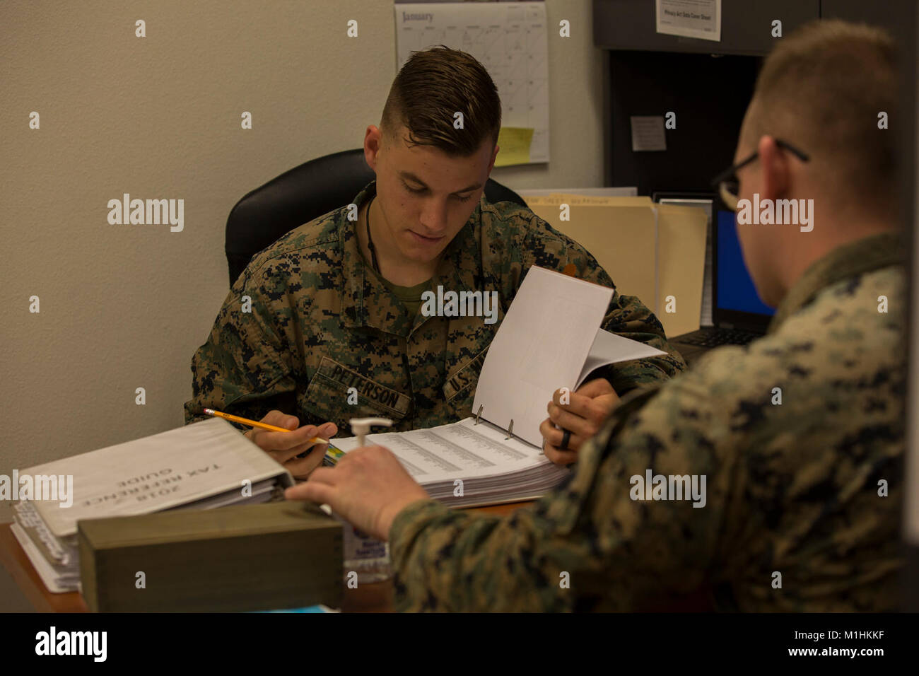 U.S. Marine Corps Cpl. Dylan Peterson, a refrigeration and air conditioning technician assigned to Marine Corps Air Control Squadron (MACS) 1, prepares taxes for a client at the Volunteer Income Tax Assistance (VITA) Tax Center at Marine Corps Air Station (MCAS) Yuma, Ariz., Jan. 22, 2018. The VITA Tax Center offers free tax preparation to all service members, Department of Defense employees, and family members at MCAS Yuma. (U.S. Marine Corps Stock Photo