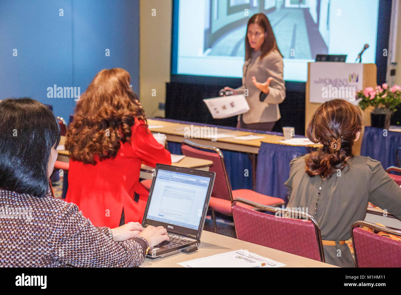 Florida,Miami Beach Convention Center,centre,woman's,woman's,men's Congress,career,networking,work,woman female women,seminar,speaker,presentation,lap Stock Photo