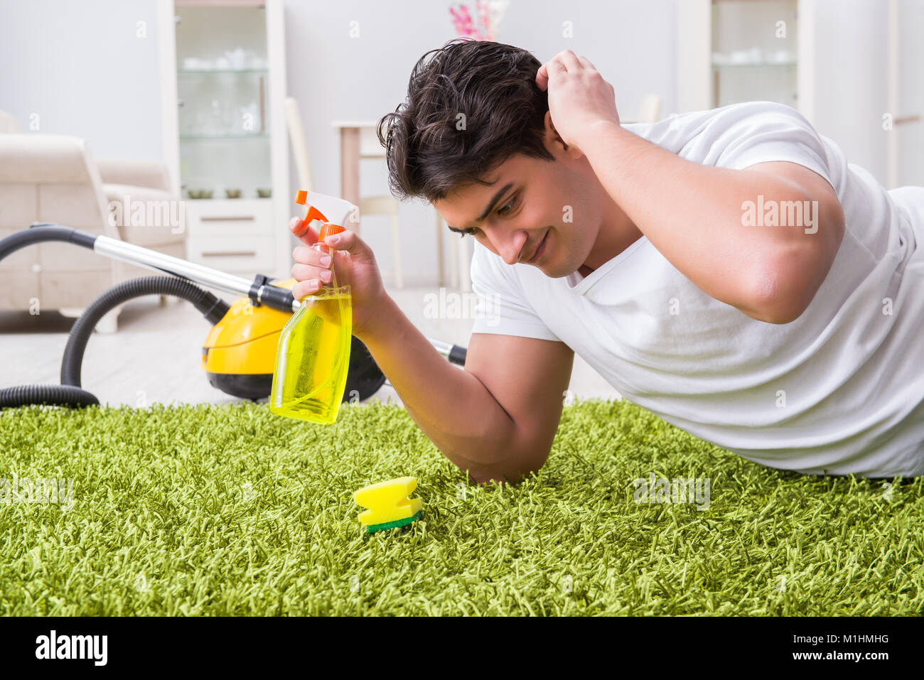 Young husband man cleaning floor at home Stock Photo Alamy
