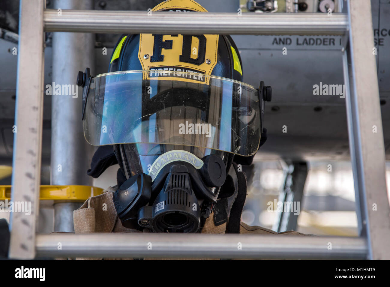 Airman 1st Class Orlando Chapman, 23d Civil Engineer Squadron (CES) firefighter, holds a ladder during extraction training, Jan. 25, 2018, at Moody Air Force Base, Ga. Firefighters from the 23d CES conducted A-10C Thunderbolt II extraction training to practice extinguishing an aircraft fire and quickly rescuing a pilot from an A-10. The 23d CES holds the extraction training twice annually and are evaluated on the amount of time it takes them to rescue a pilot from the cockpit. (U.S. Air Force Stock Photo