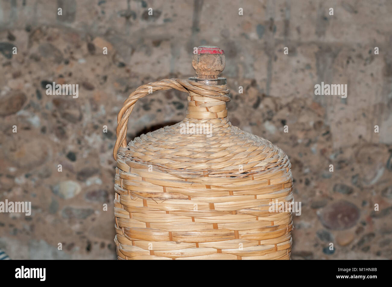 antique wattled wicker bottle Stock Photo