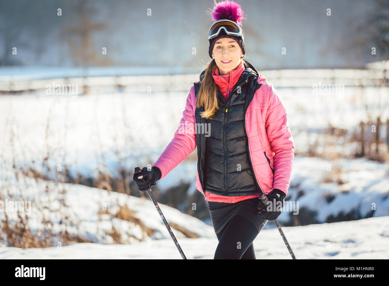 Woman on the trail for a winter hike Stock Photo