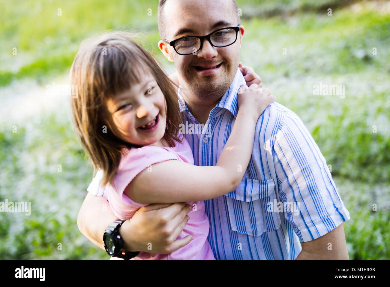 Picture of girl and man with down syndrome Stock Photo