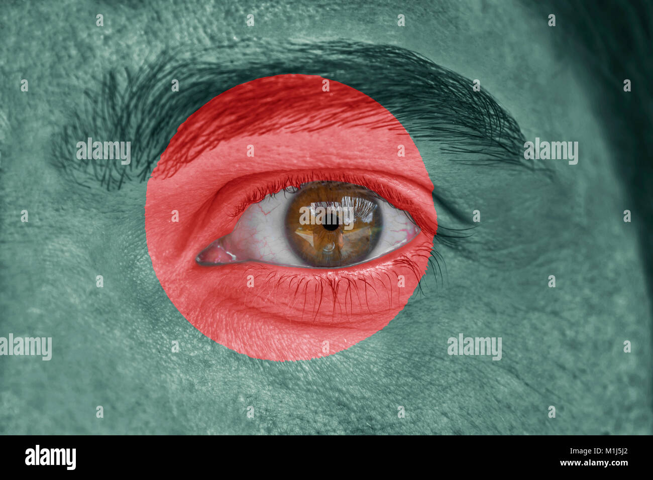 Human face and eye painted with flag of Bangladesh Stock Photo