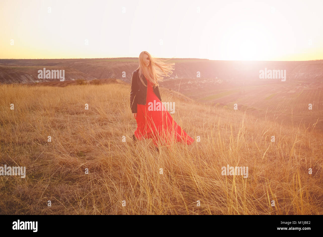 Girl in red dress Stock Photo - Alamy