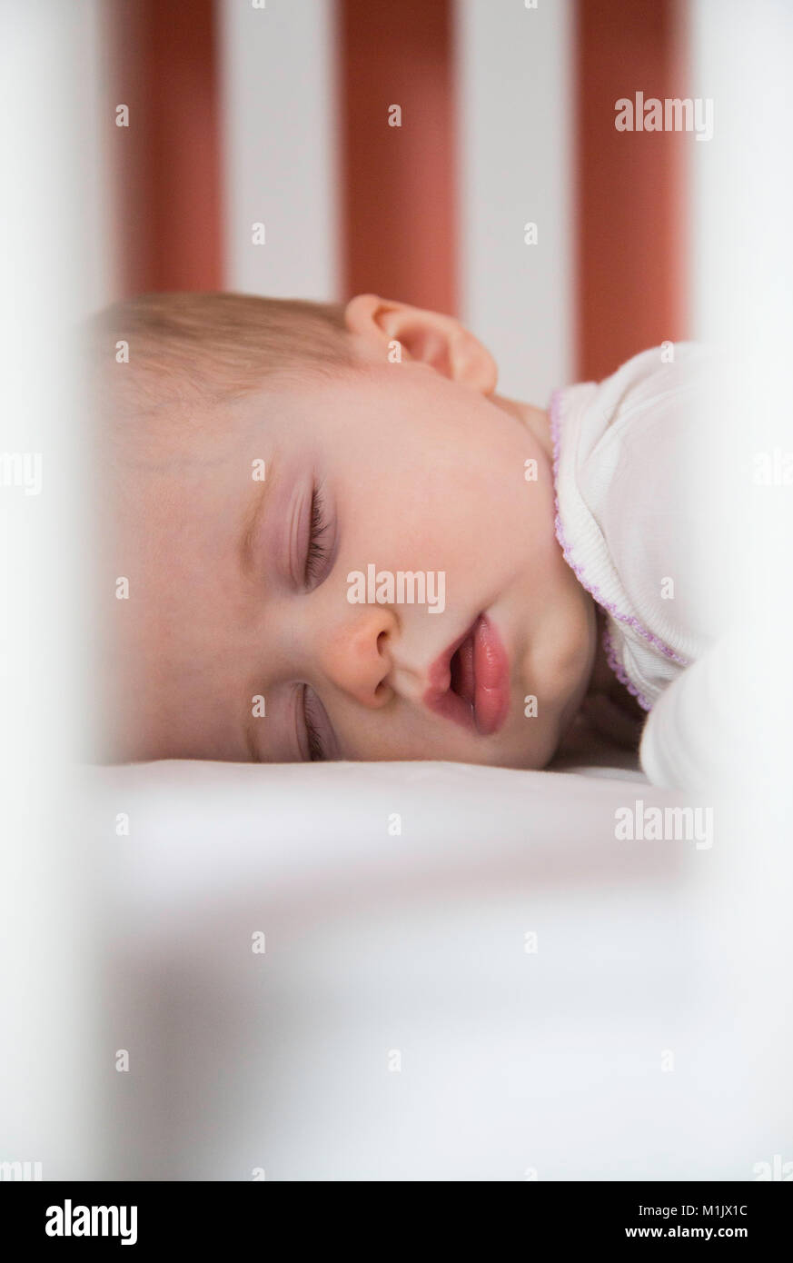 Baby Sleeping in Crib Stock Photo Alamy