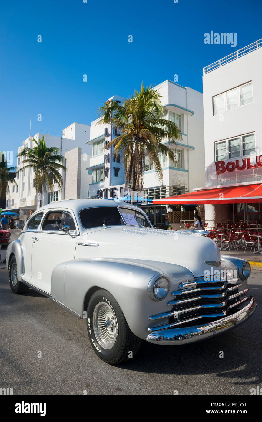 MIAMI - January 13, 2018: A vintage American automobile parks on Ocean Drive during the annual Art Deco Weekend classic car show in South Beach. Stock Photo