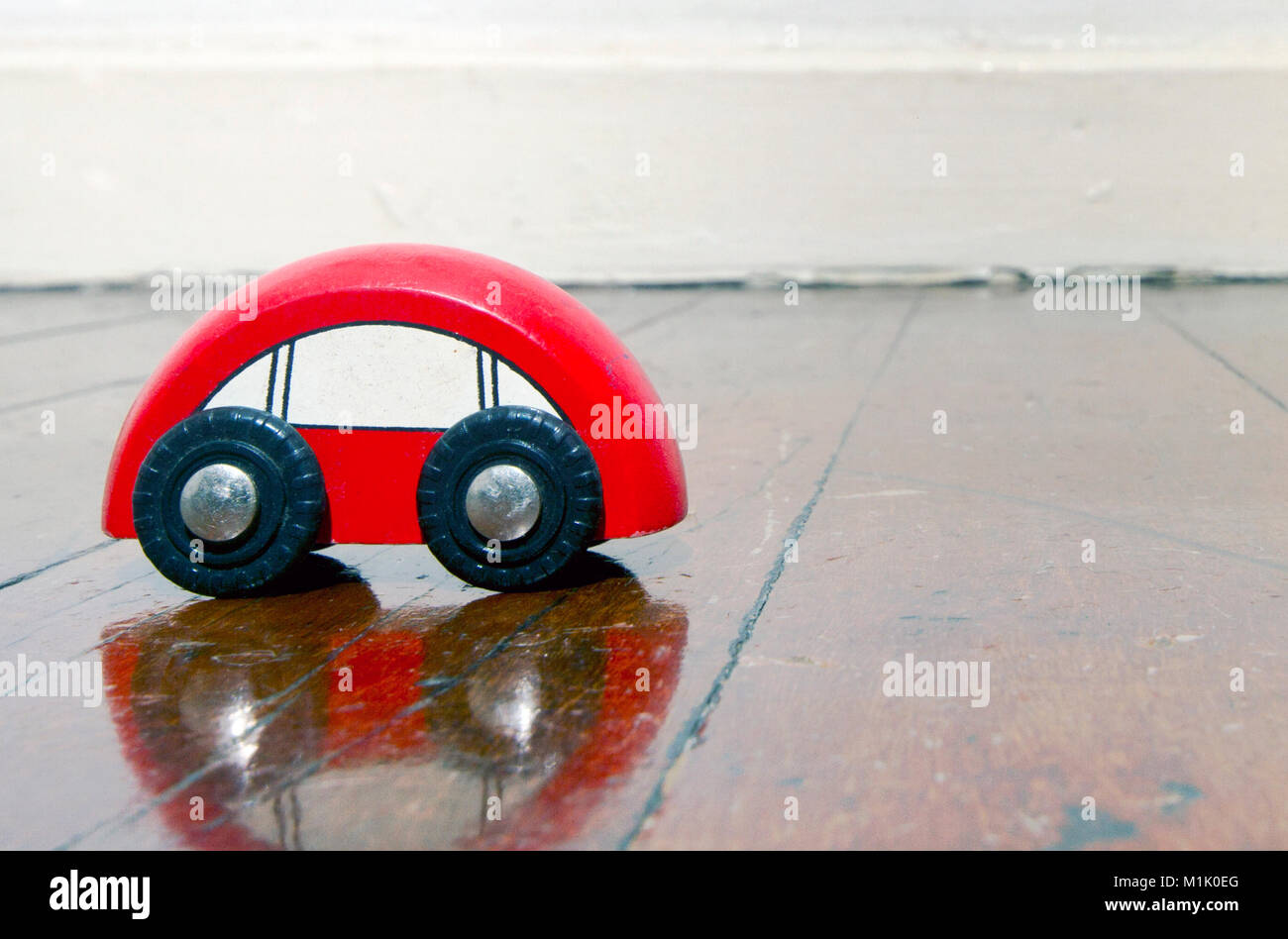 retro red wooden car toy on a old wooden floor Stock Photo - Alamy