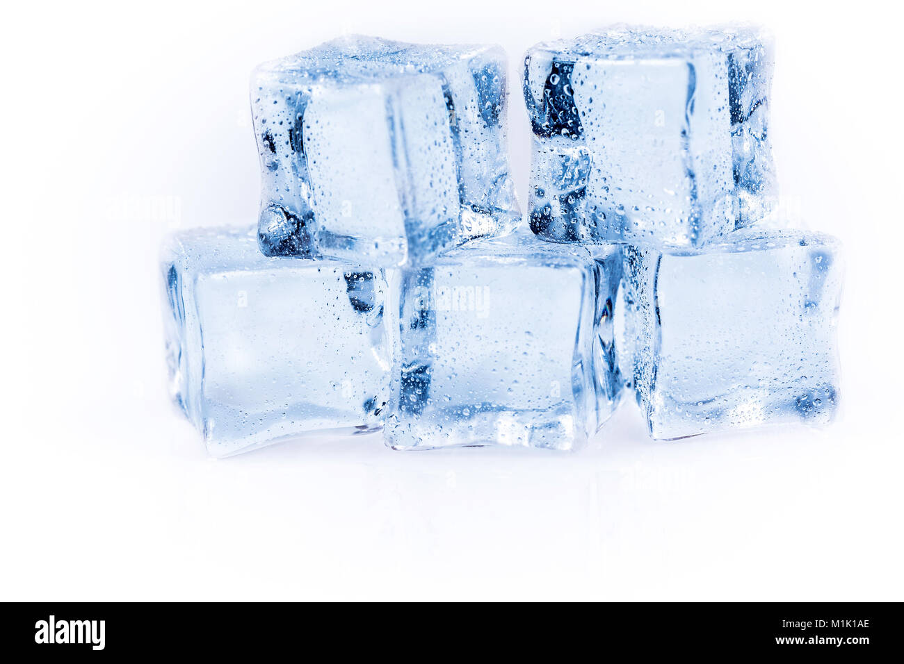 Many ice cubes on white reflection background Stock Photo - Alamy