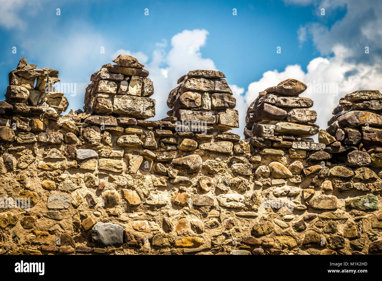 An old stone wall of an ancient fortress close up Stock Photo - Alamy