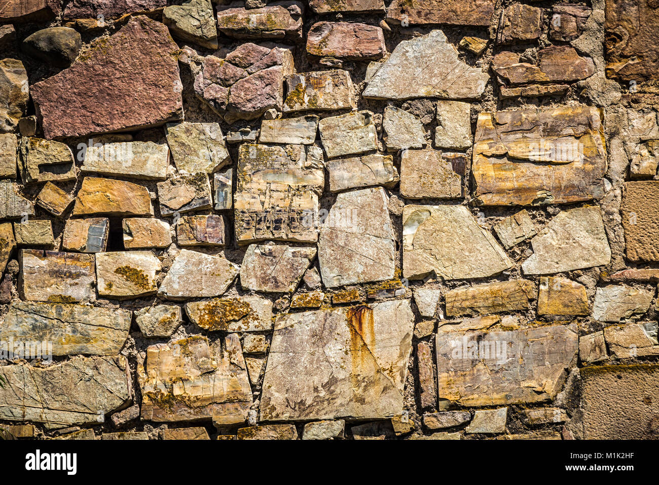 An old stone wall of an ancient fortress close up Stock Photo - Alamy