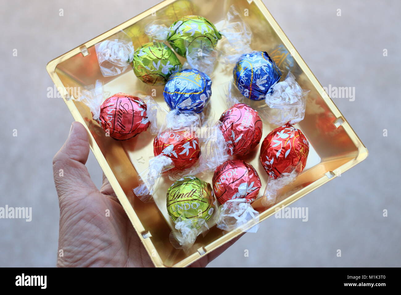 Close up of Assorted Lindt Lindor Chocolates in gold colour box Stock Photo