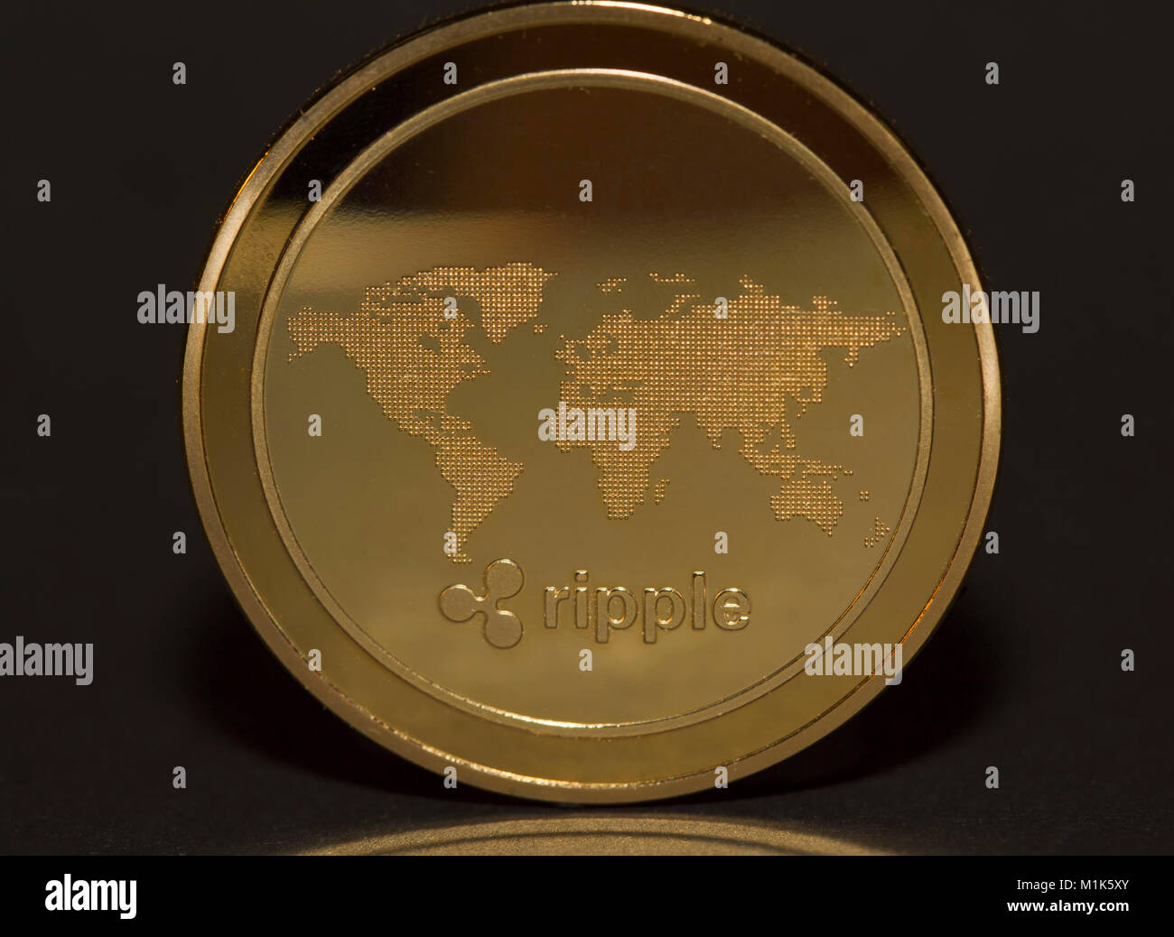 Backside of the cryptocurrency ripple, gold coin, studio shot, cutout Stock Photo