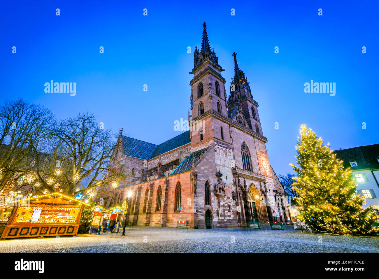 Basel, Switzerland. Christmas fairytale market at Munsterplatz and Munster Cathedral, Swiss Confederation. Stock Photo