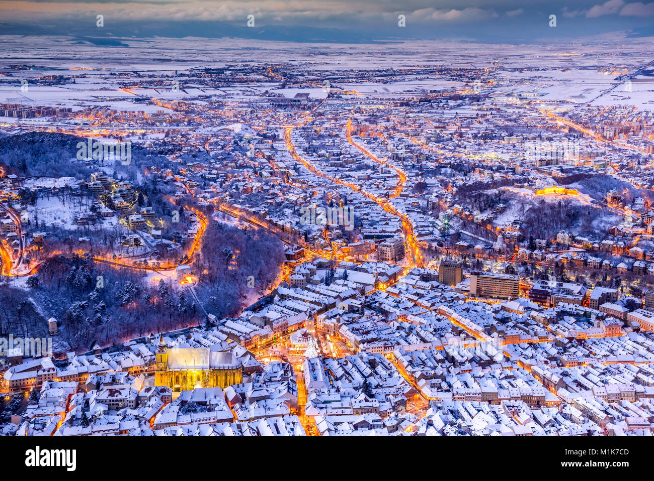 Brasov, Romania. Aerial view of medieval city and Main Square, with Xmas Tree and lights Transylvania landmark, Eastern Europe Stock Photo