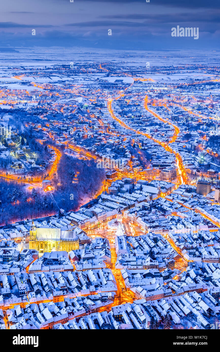 Brasov, Romania. Aerial view of medieval city and Main Square, with Xmas Tree and lights Transylvania landmark, Eastern Europe Stock Photo