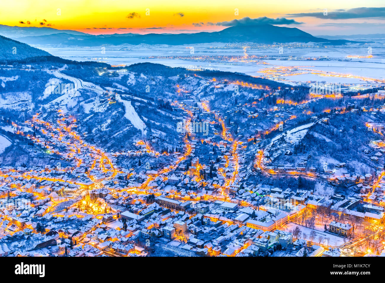 Brasov, Romania. Aerial view of medieval city and Main Square, with Xmas Tree and lights Transylvania landmark, Eastern Europe Stock Photo