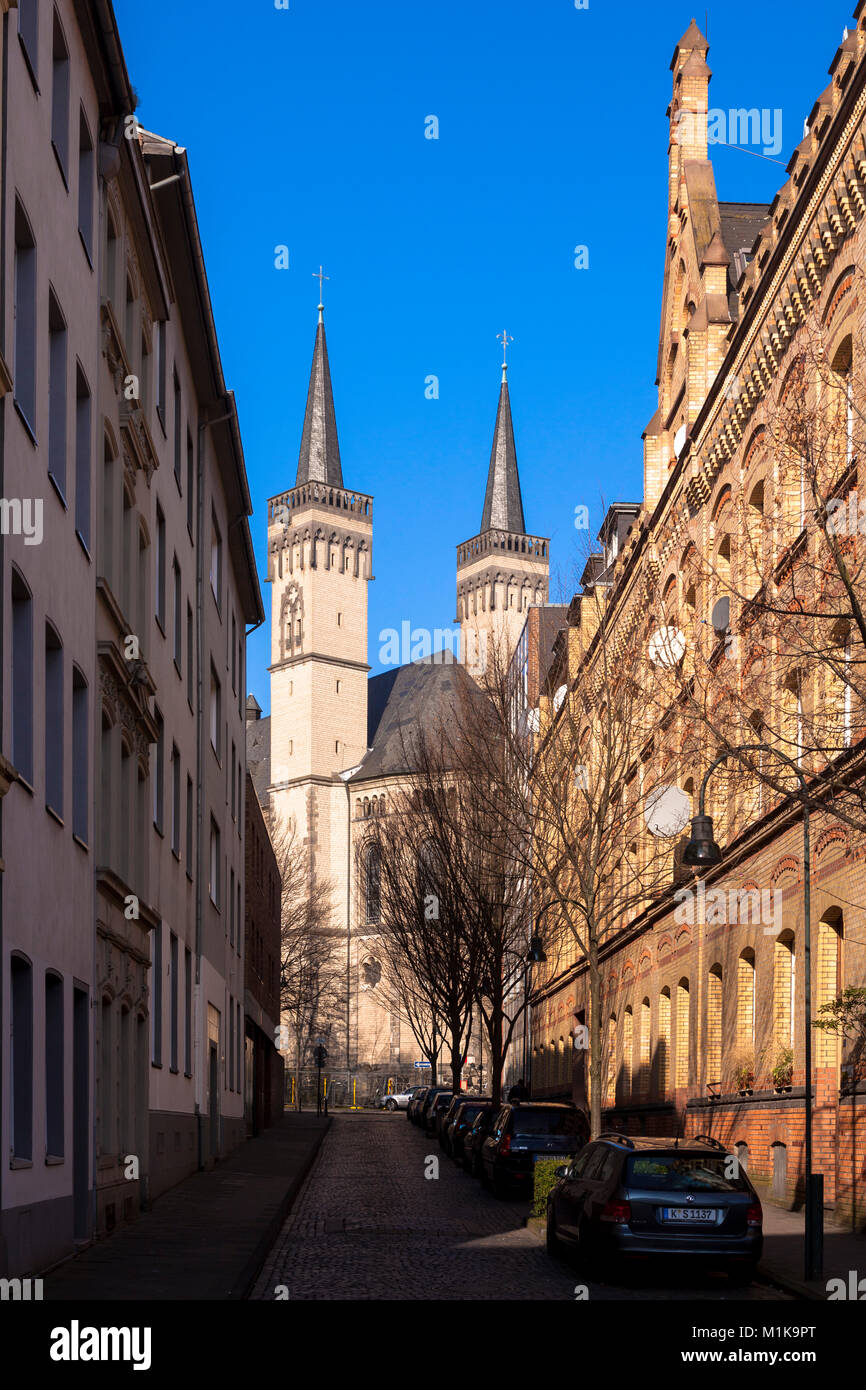 Germany, Cologne, the street Severinsmuehlengasse and church St. Severin in the district Suedstadt.  Deutschland, Koeln, Severinsmuehlengasse und Kirc Stock Photo