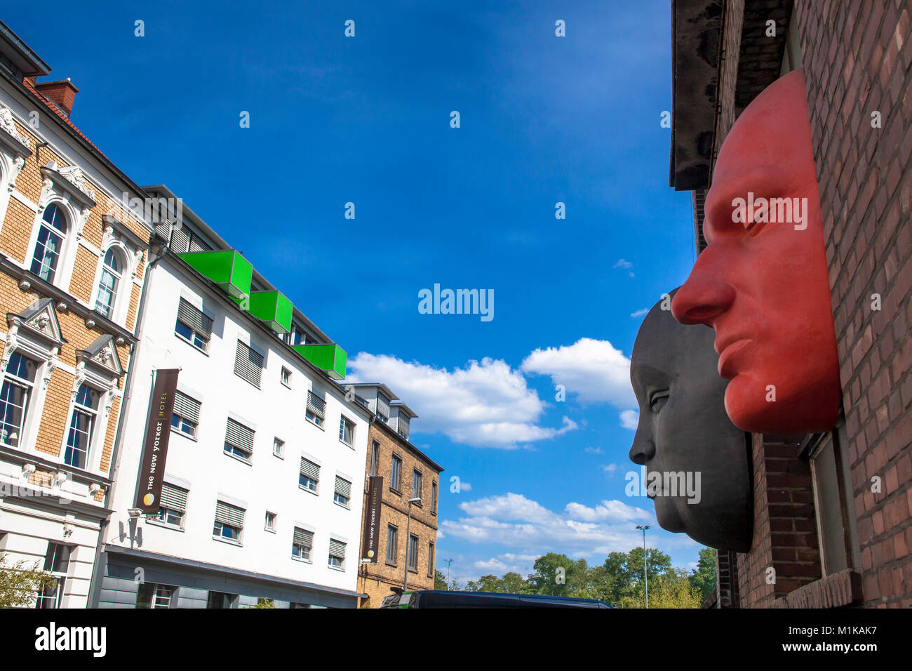 Germany, Cologne, The New Yorker Design Hotel in the district Muelheim, oversized faces on the facade of the opposite building.   Deutschland, Koeln,  Stock Photo