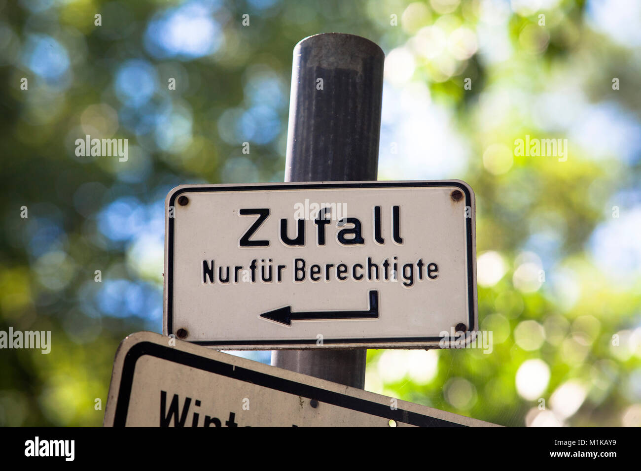 Germany, Cologne, curious sign in the southern part of the city (translation: coincidence - only for authorized).  Deutschland, Koeln, merkwuerdiges S Stock Photo