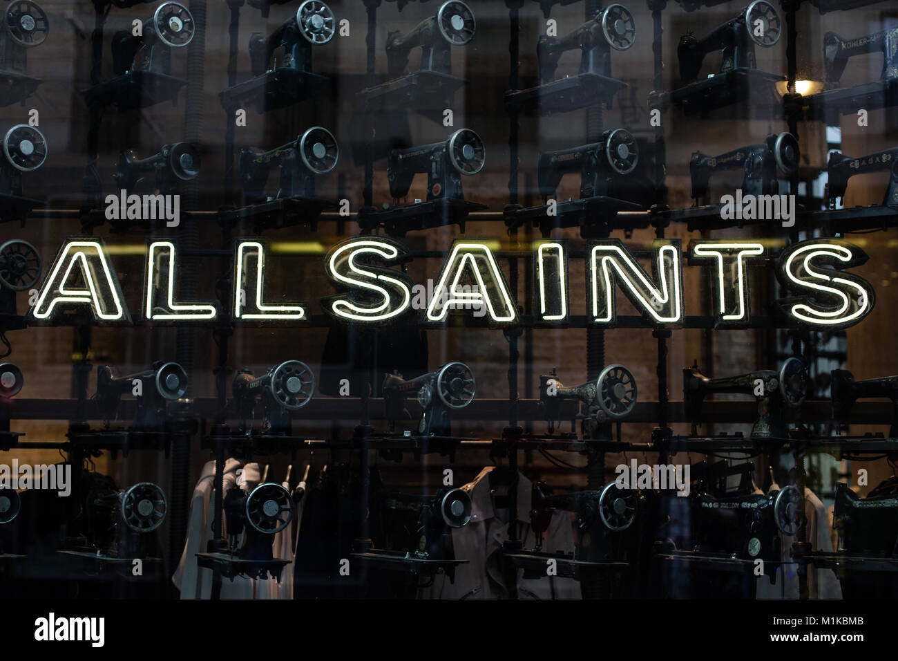 All Saints Clothing Store Window Design Display with old vintage black  sewing machines on Friedrichstrasse in Berlin, Germany Stock Photo - Alamy