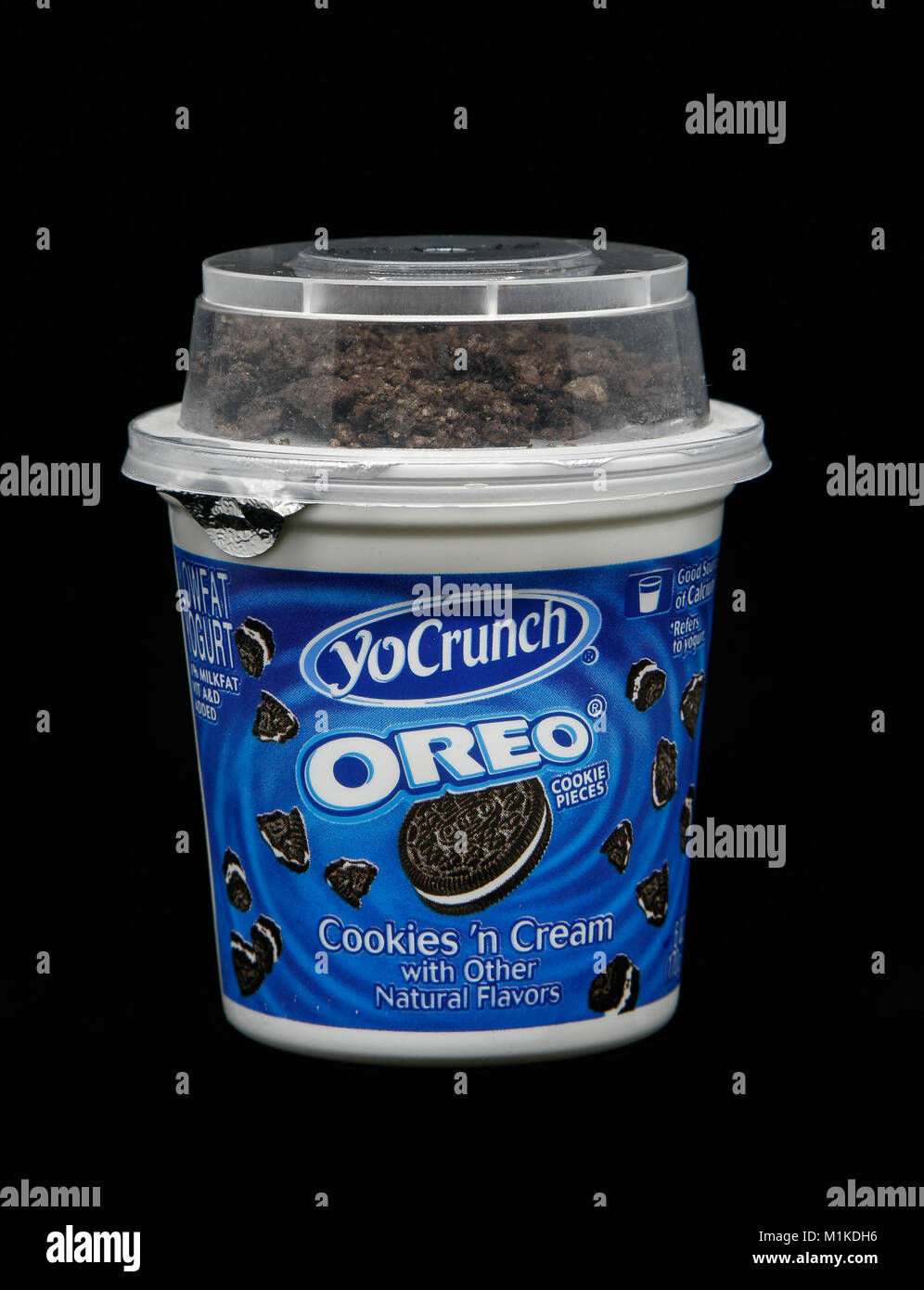 New York, December 4, 2017:  Container of Oreo Cookies and Cream yogurt stands against black background. Stock Photo