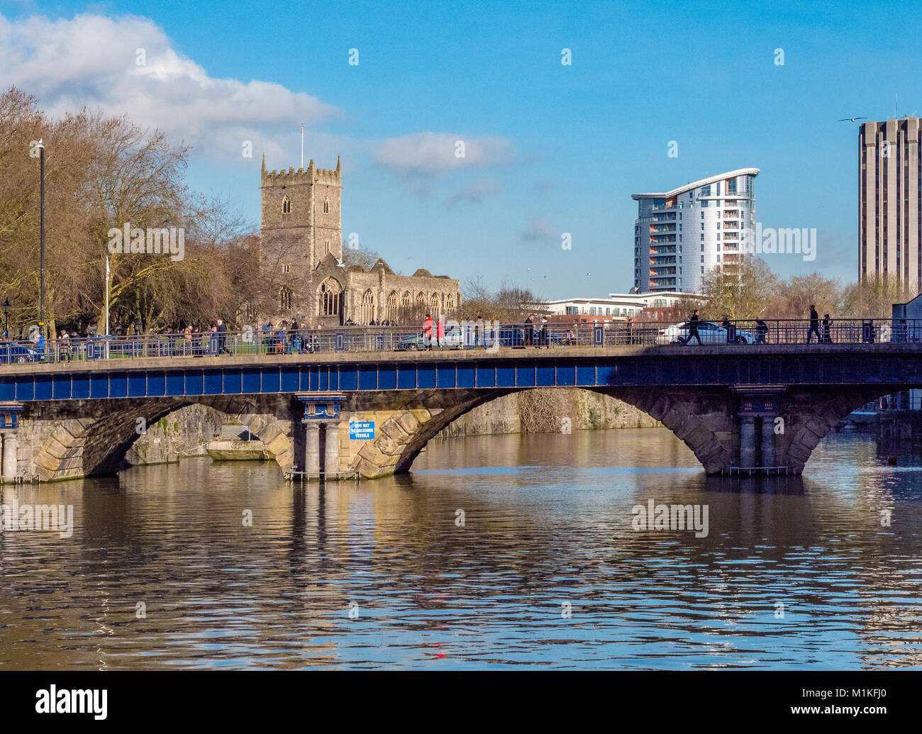 Bristol Bridge over the city's floating harbour - once the course of the River Avon with St Peter's church and Eclipse Tower beyond Stock Photo