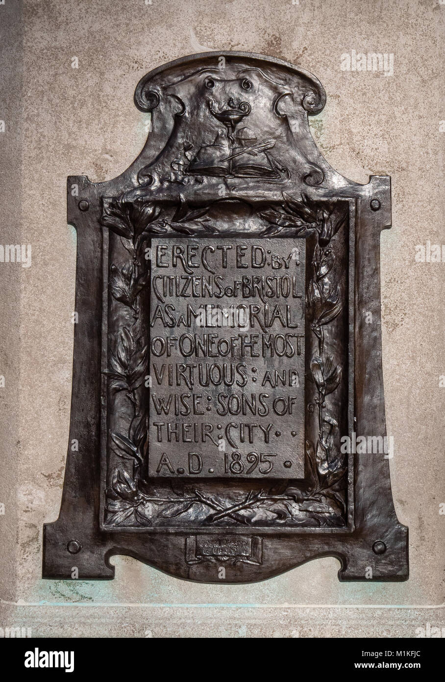 Bronze eulogy plaque from the grateful citizens of Bristol on the plinth of a statue of philanthropist and slave trader Edward Colston in city centre Stock Photo