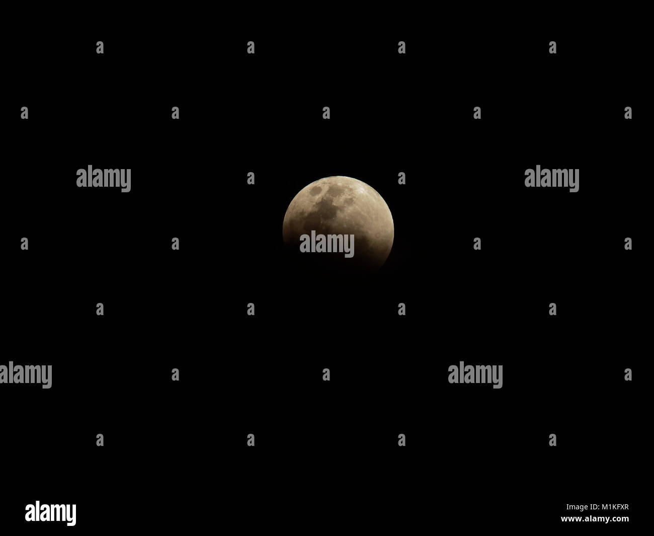 Super blue blood moon with partial lunar eclipse over dark sky ...