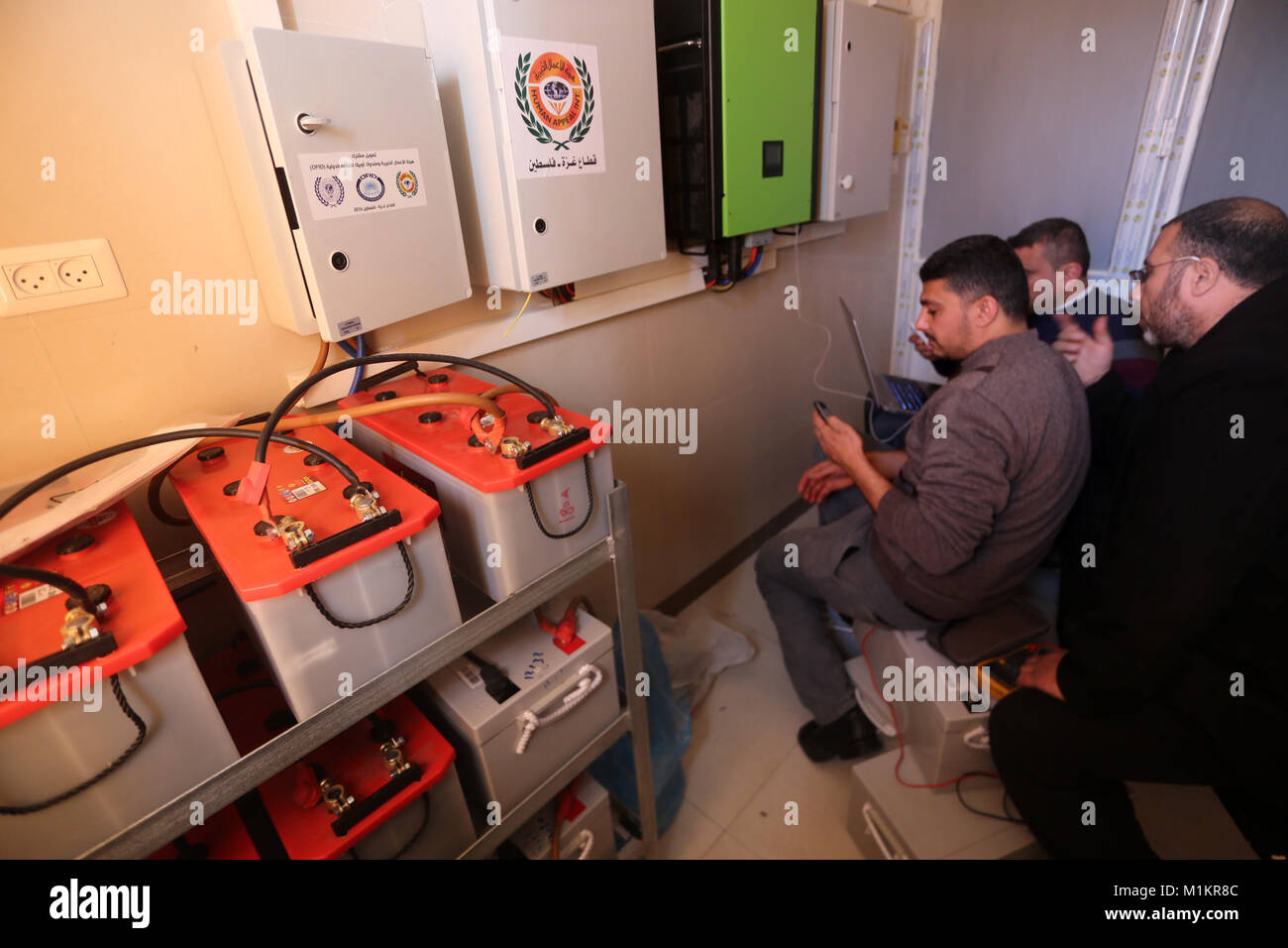 February 1, 2018 - Gaza City, Gaza Strip, Palestinian Territory - Palestinian workers inspect the run generators at the Mohammed al-Dorra pediatric hospital in Gaza city on January 31, 2018 after it ran out of fuel. For months Gazaâ€™s health ministry has been warning that it will be forced to reduce health services and to take austerity measures, because it lacks the fuel to run generators  (Credit Image: © Mohammed Asad/APA Images via ZUMA Wire) Stock Photo