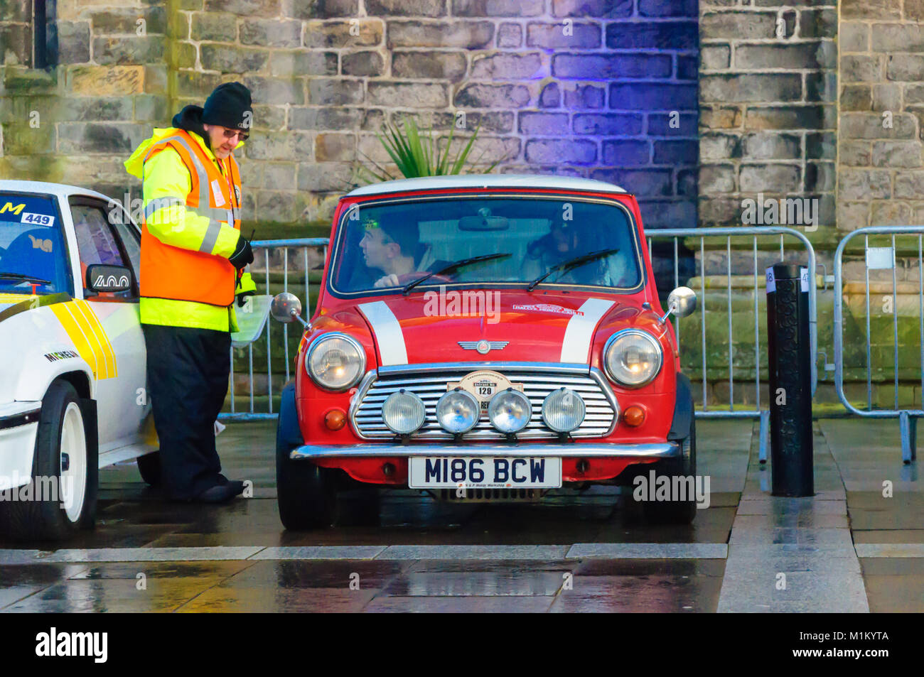 Paisley, Scotland, UK. 31st January 2018: A red and white Mini Cooper. The Monte Carlo Rally starts at Paisley Abbey. This year sees the 21st  Historique event and the 3rd Classique event. Both events are staged by the Automobile Club de Monaco  and take place on open public roads. The distance to Monte Carlo is 1270 miles. Credit: Skully/Alamy Live News Stock Photo