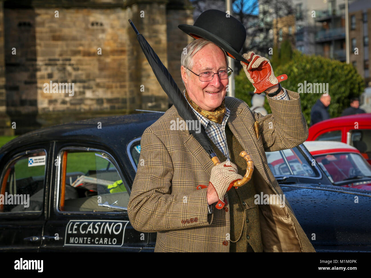 Paisley, Scotland, UK. 31st January, 2018. On a cold and sometimes very wet January day, 1000's of spectators turned out at Paisley Abbey, Renfrewshire to cheer off the 79 national and international entrants to the 2018 Rallye Monte Carlo Historique. Image is of GORDON BEST form ALVA , Stirlingshire about to set off in his 1960 Rover 100 Credit: Findlay/Alamy Live News Stock Photo
