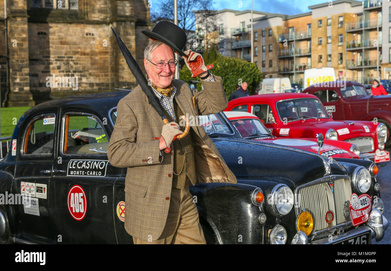 Paisley, Scotland, UK. 31st January, 2018. On a cold and sometimes very wet January day, 1000's of spectators turned out at Paisley Abbey, Renfrewshire to cheer off the 79 national and international entrants to the 2018 Rallye Monte Carlo Historique. Image is of GORDON BEST from ALVA in Stirlingshire about to set off in his 1960 Rover 100 Credit: Findlay/Alamy Live News Stock Photo