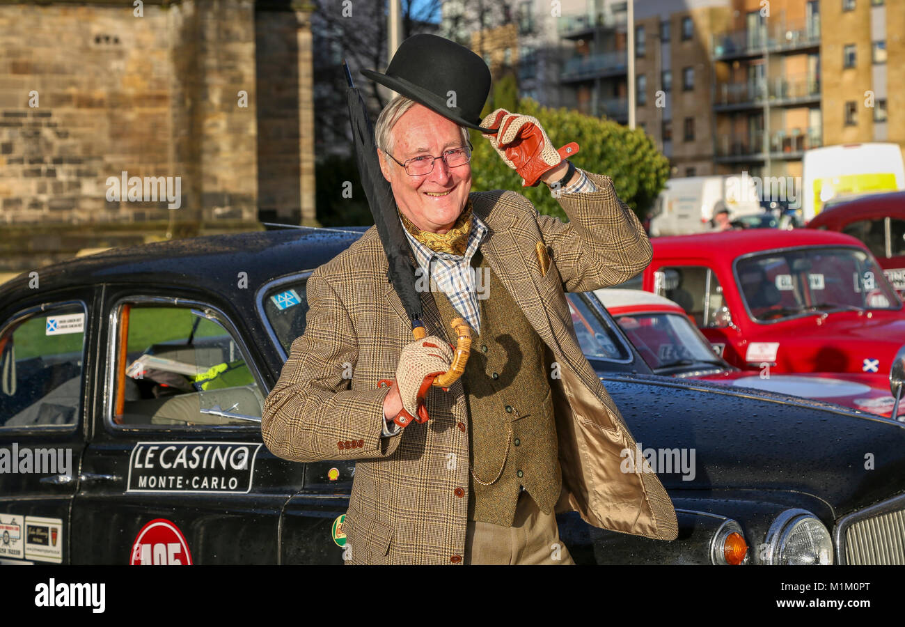 Paisley, Scotland, UK. 31st January, 2018. On a cold and sometimes very wet January day, 1000's of spectators turned out at Paisley Abbey, Renfrewshire to cheer off the 79 national and international entrants to the 2018 Rallye Monte Carlo Historique. Image is of GORDON BEST from Alva, Stirlingshire about to set off in his 1960 Rover 100 Credit: Findlay/Alamy Live News Stock Photo
