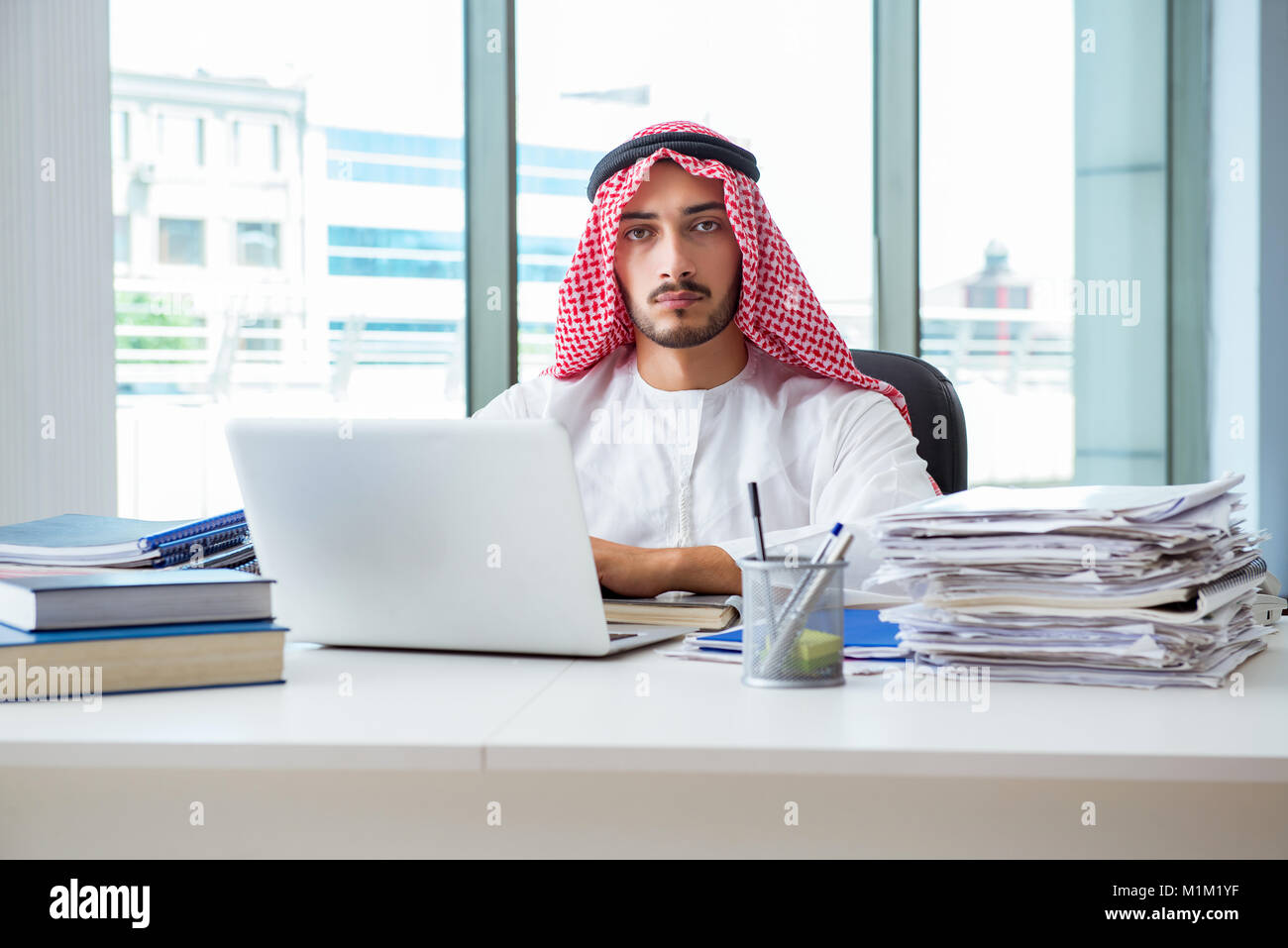 Arab businessman working in the office Stock Photo - Alamy