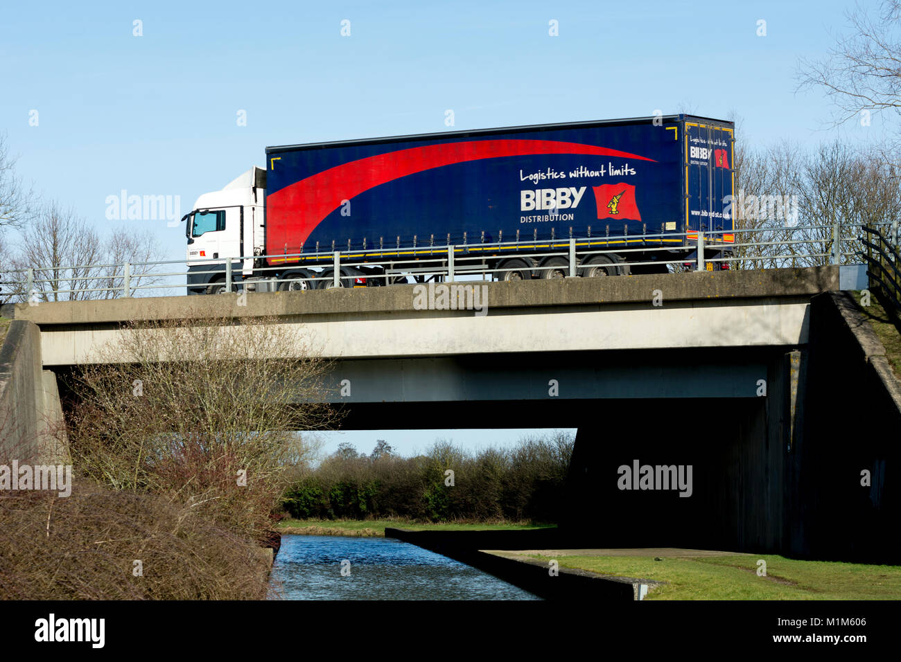 An articulated lorry on the M40 motorway crossing the Oxford Canal, Banbury, Oxfordshire, UK Stock Photo