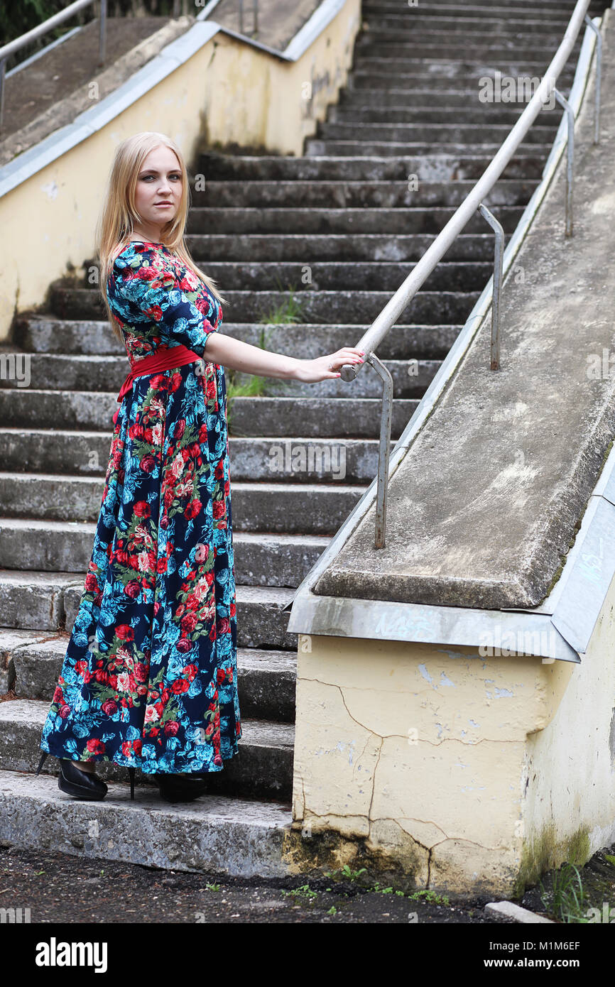 Girl in the street with an umbrella Stock Photo - Alamy
