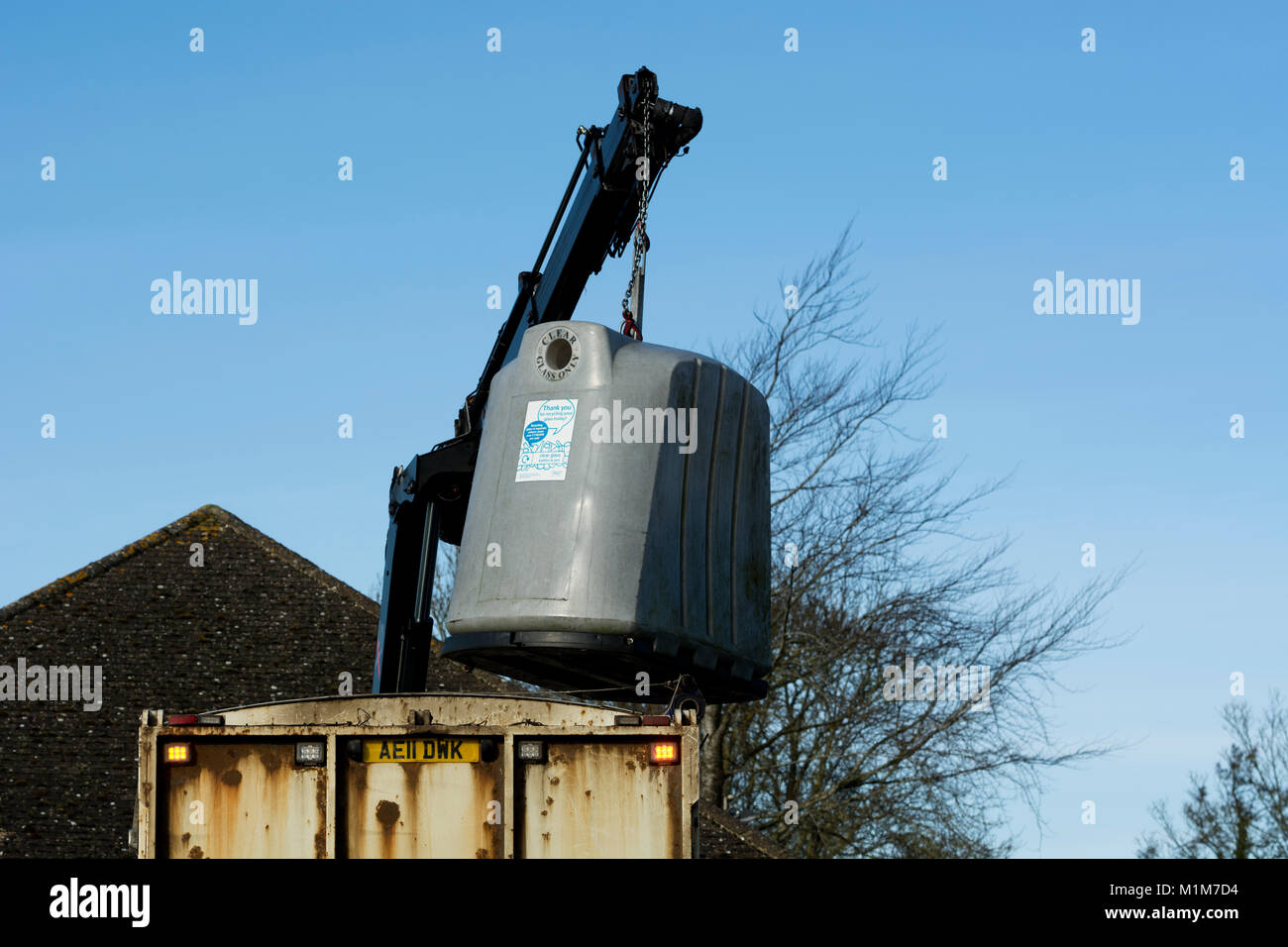 Glass recycling bin being emptied, Oxfordshire, UK Stock Photo